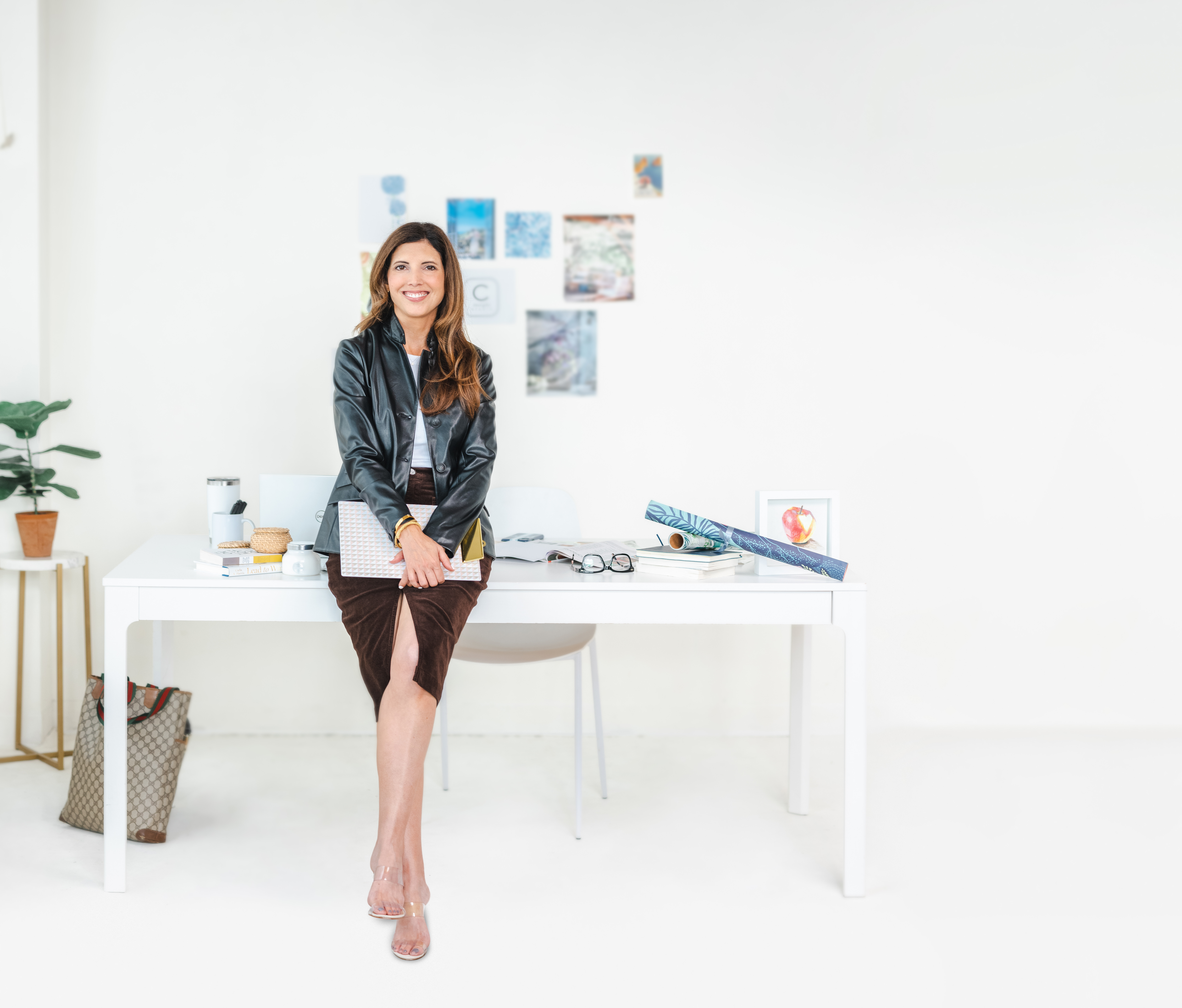 Danielle standing in front of desk in studio