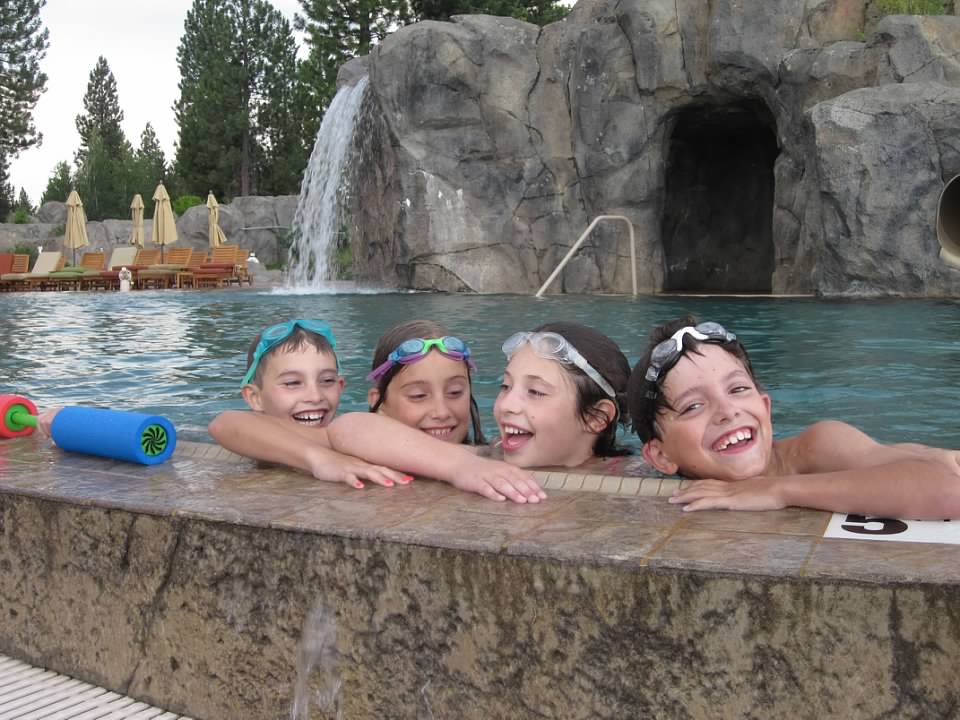 Kids having fun swimming on a summer vacation in Oregon