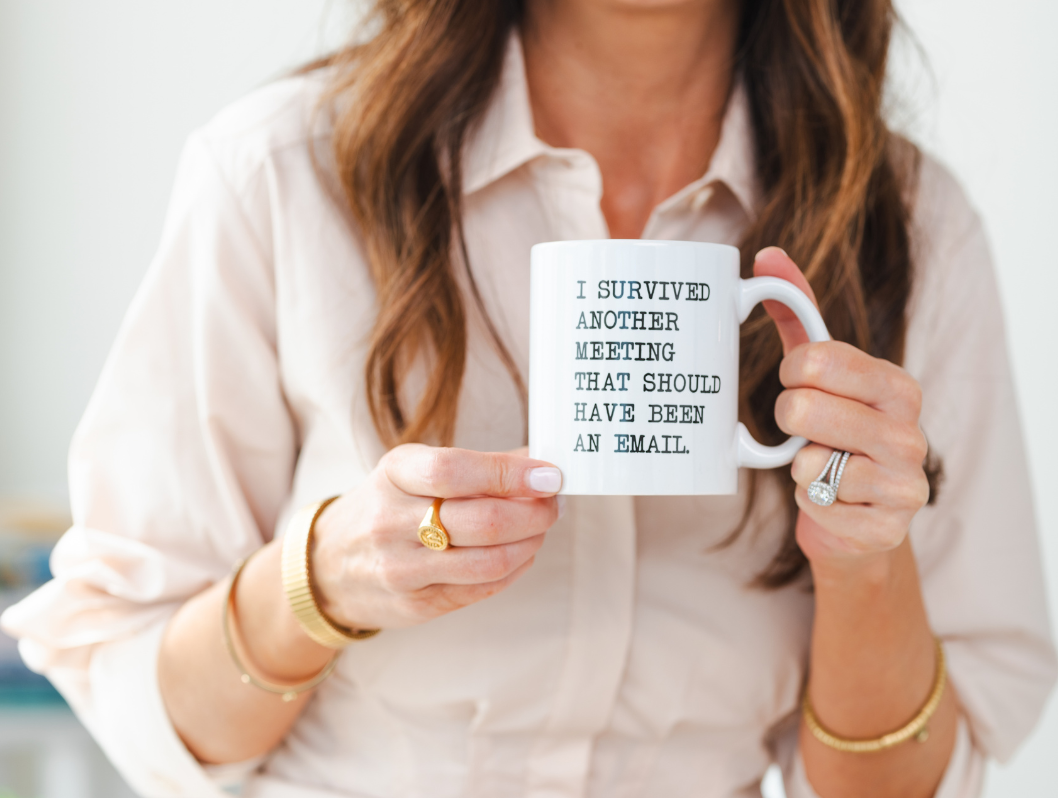 Mug that says: "I survived another meeting that should have been an email mug"