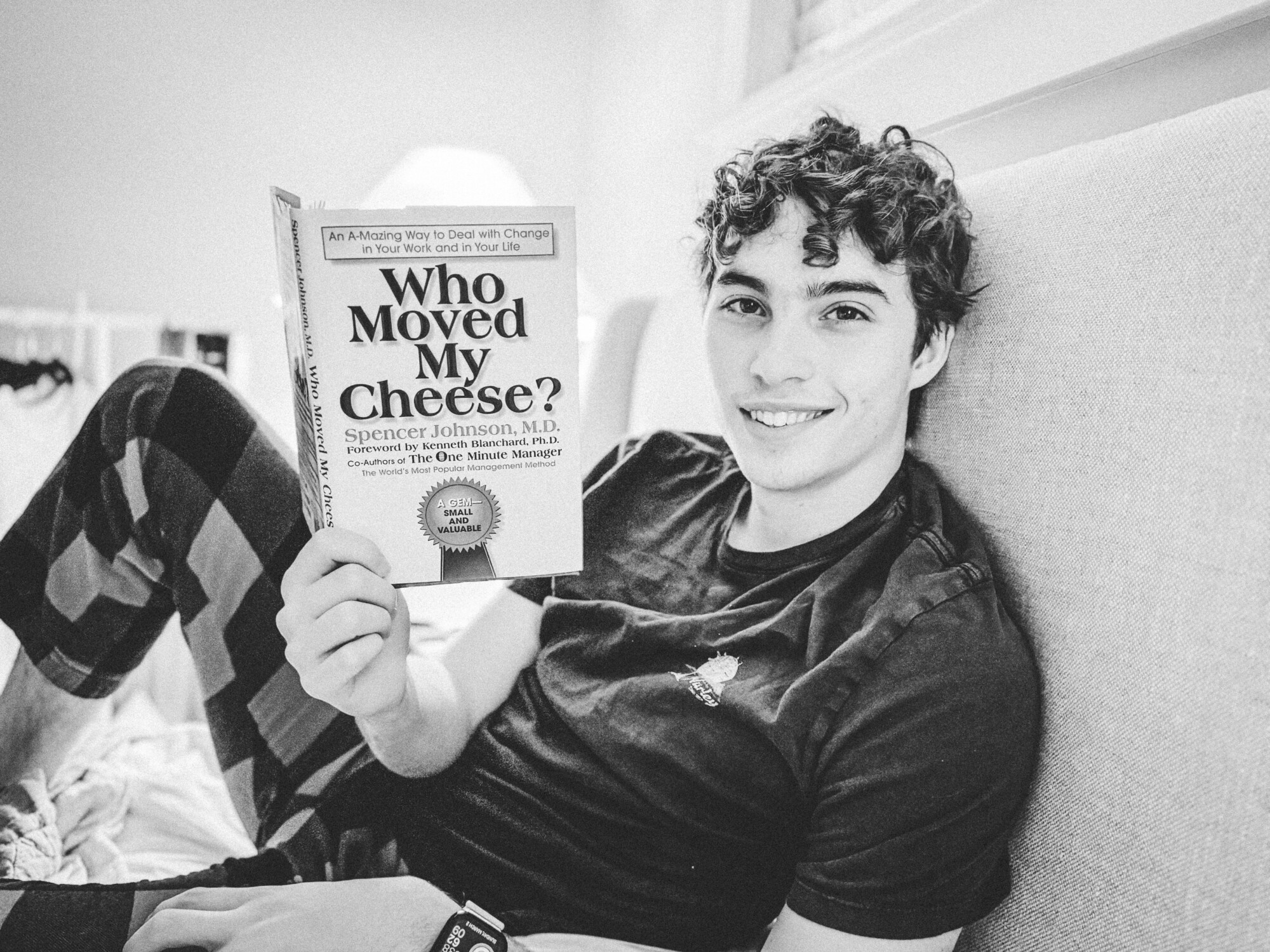 Dylan holding book called Who Moved My Cheese